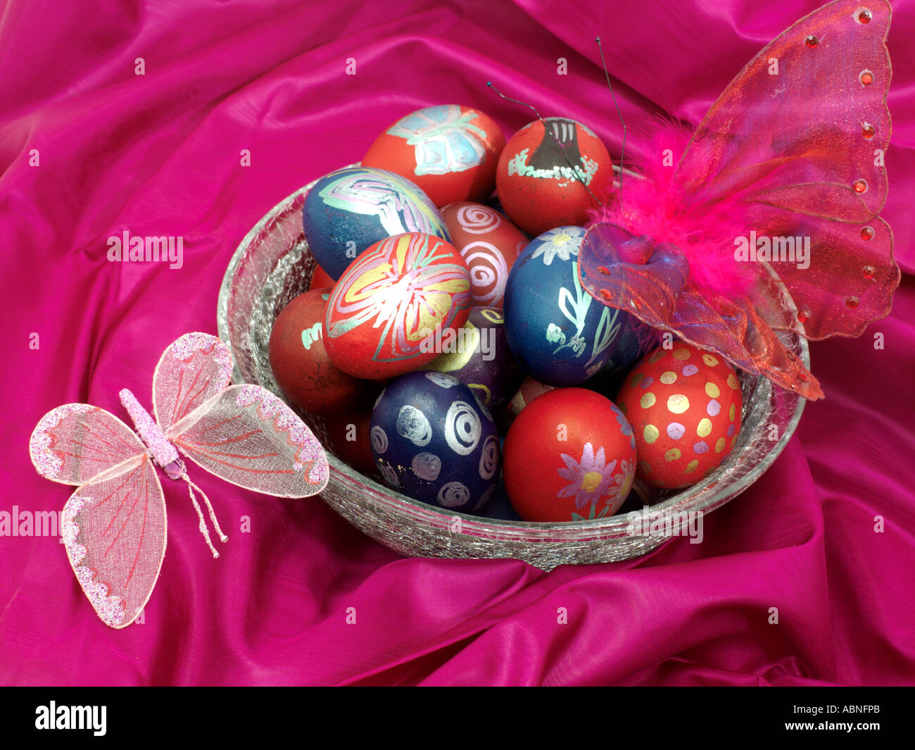 Butterflies and Easter Eggs on Pink Silk Stock Photo