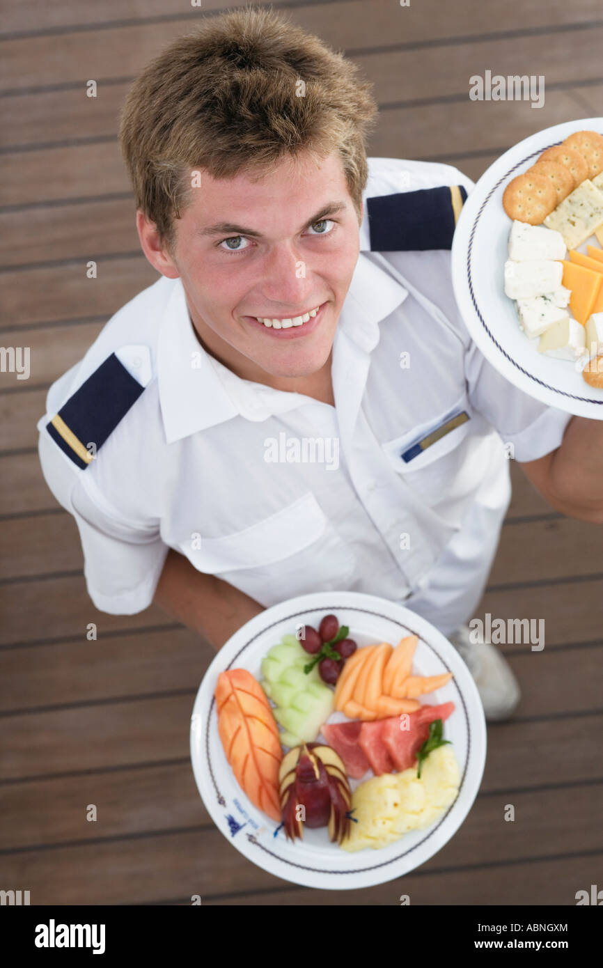 Waiter holding plates of food Stock Photo Alamy