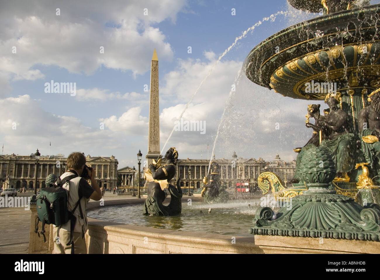 Man photographing Fountain and Obelisk at Place de la Concorde Paris France Stock Photo