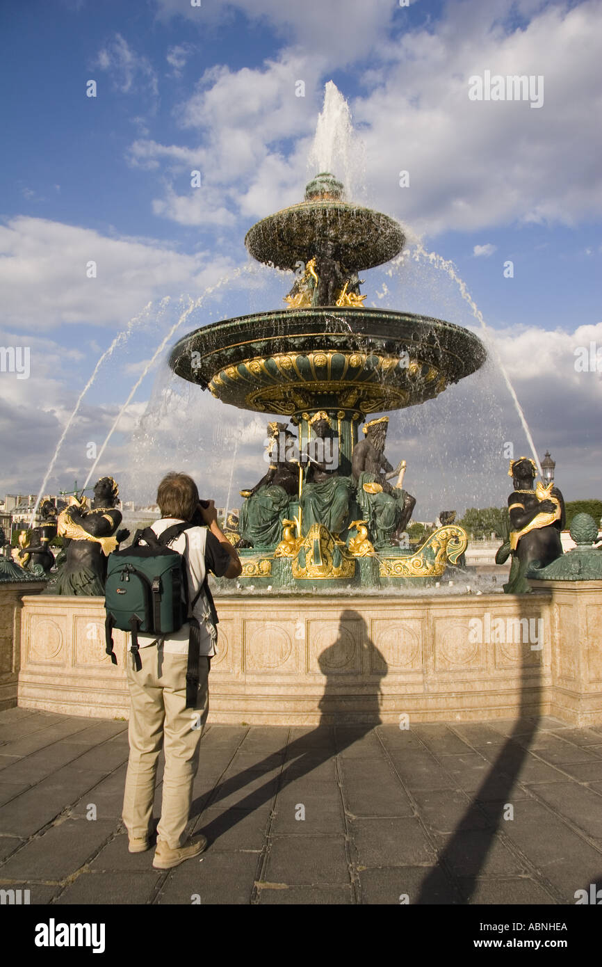 Man photographing Fountain at Place de la Concorde Paris France Stock Photo