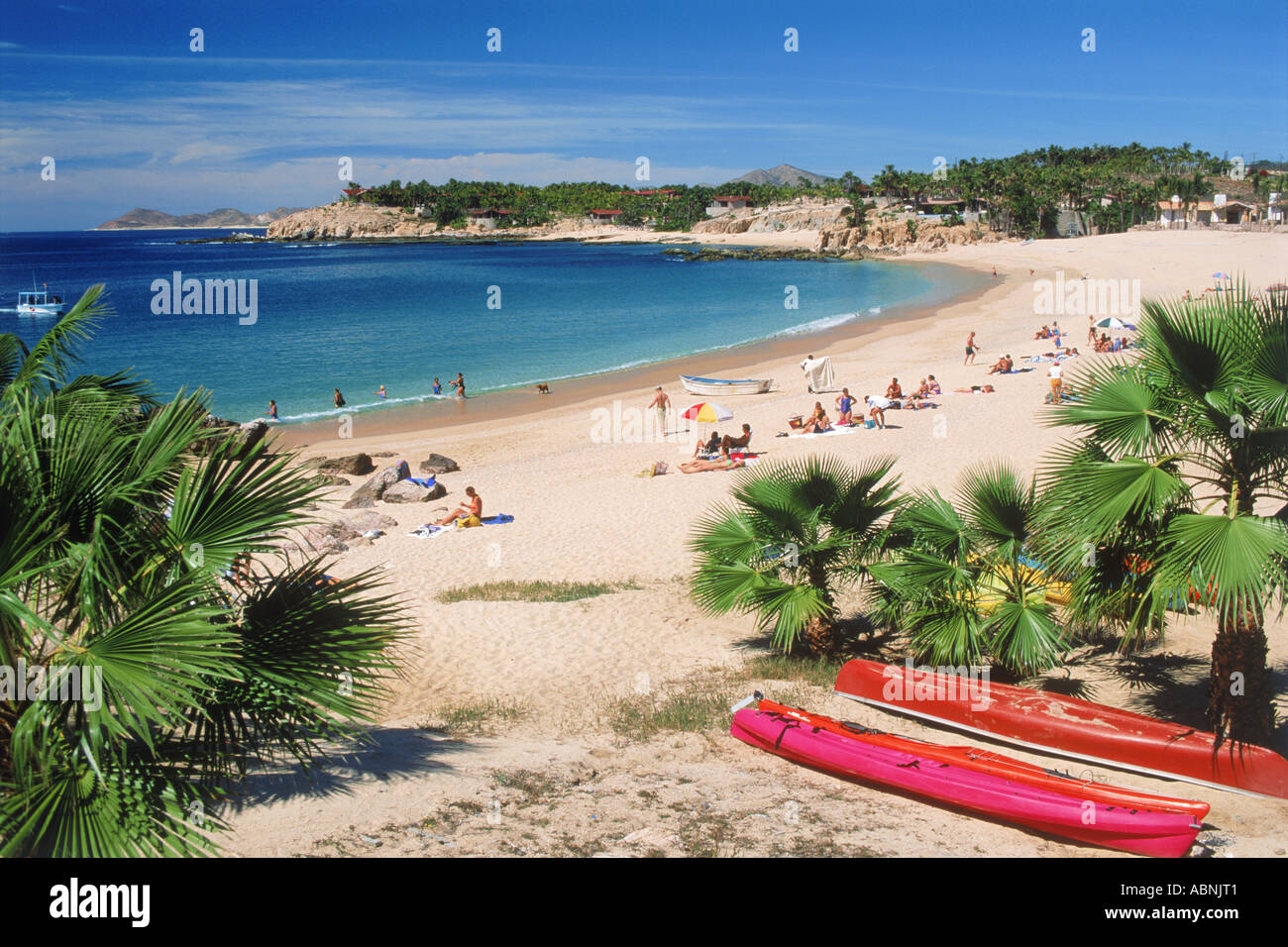 Beach with tourists and kayaks on blue Pacific Ocean at San Jose Del Cabo in Baja, Mexico Stock Photo
