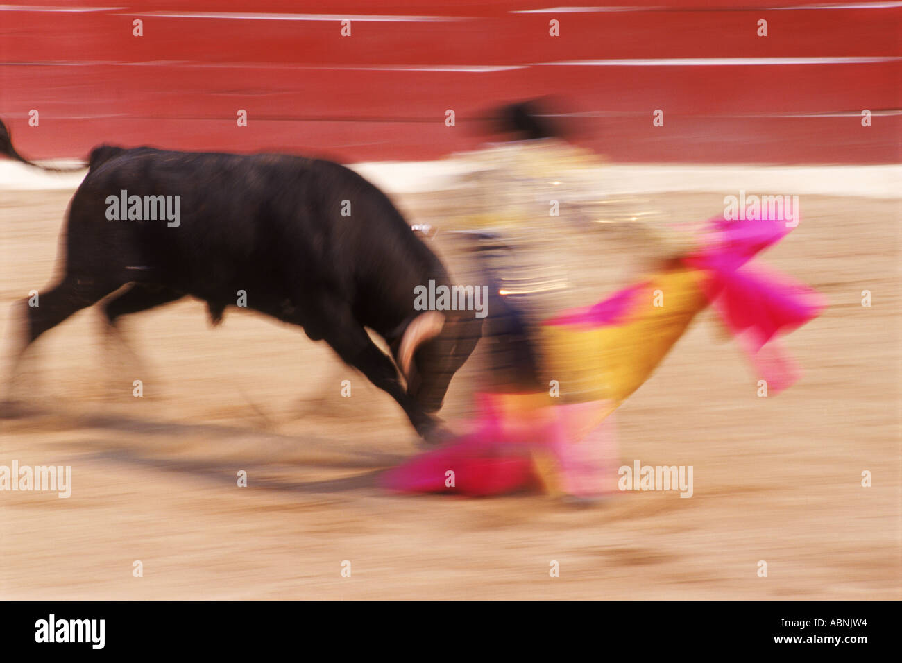 Bull's horn just missing matador during bullfight Stock Photo