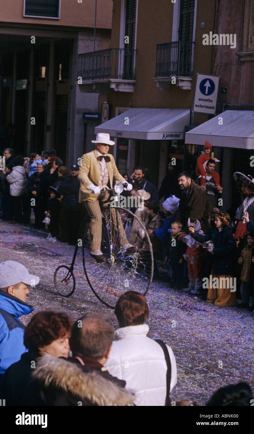 Riding a Penny Farthing bike in the annual Verona Mardi Gras parade Stock Photo