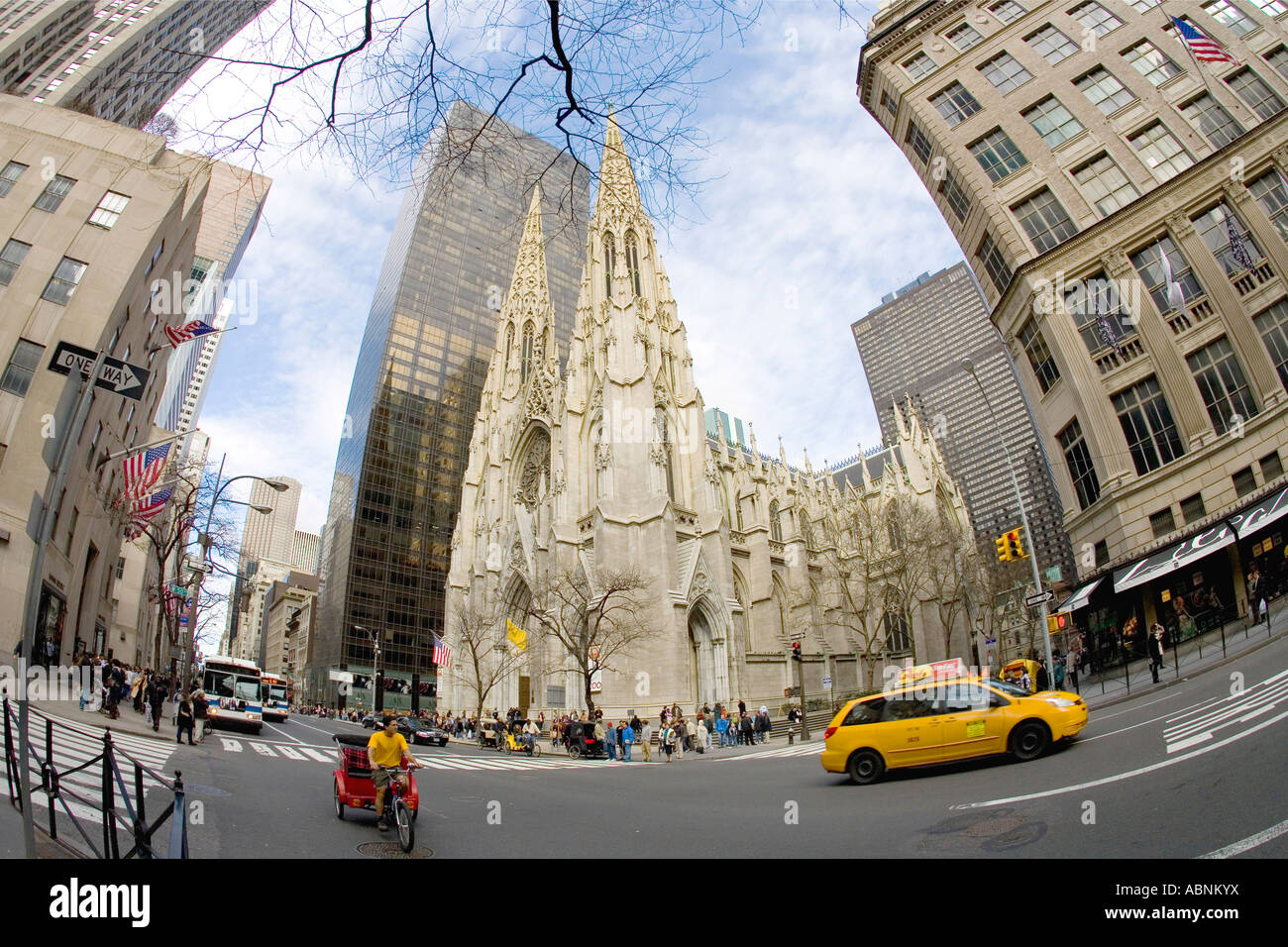 St Patricks Patrick's Cathedral and yellow taxi cab on 5th Fifth Avenue downtown Manhattan New York NY United States America Stock Photo