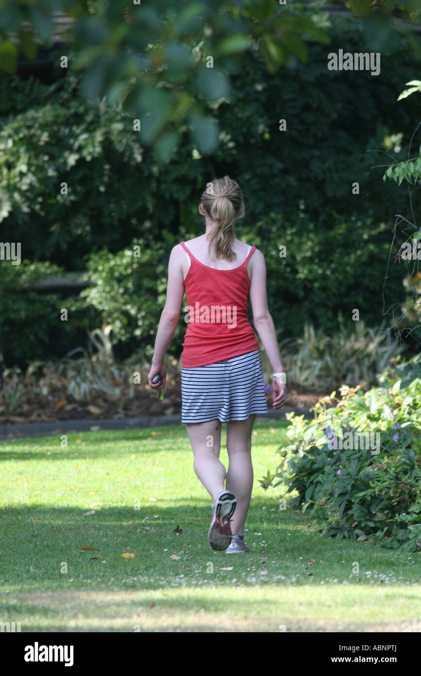 a girl walking in the park Stock Photo - Alamy