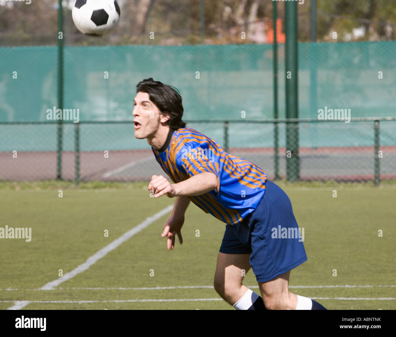 Soccer player heading the ball Stock Photo - Alamy