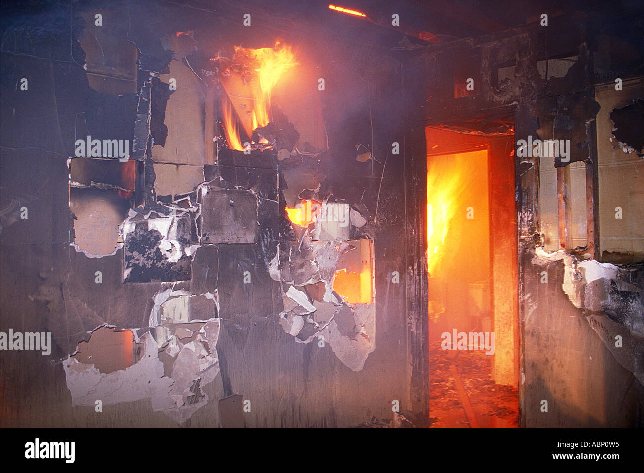 Fire wrecked room in flames. Stock Photo