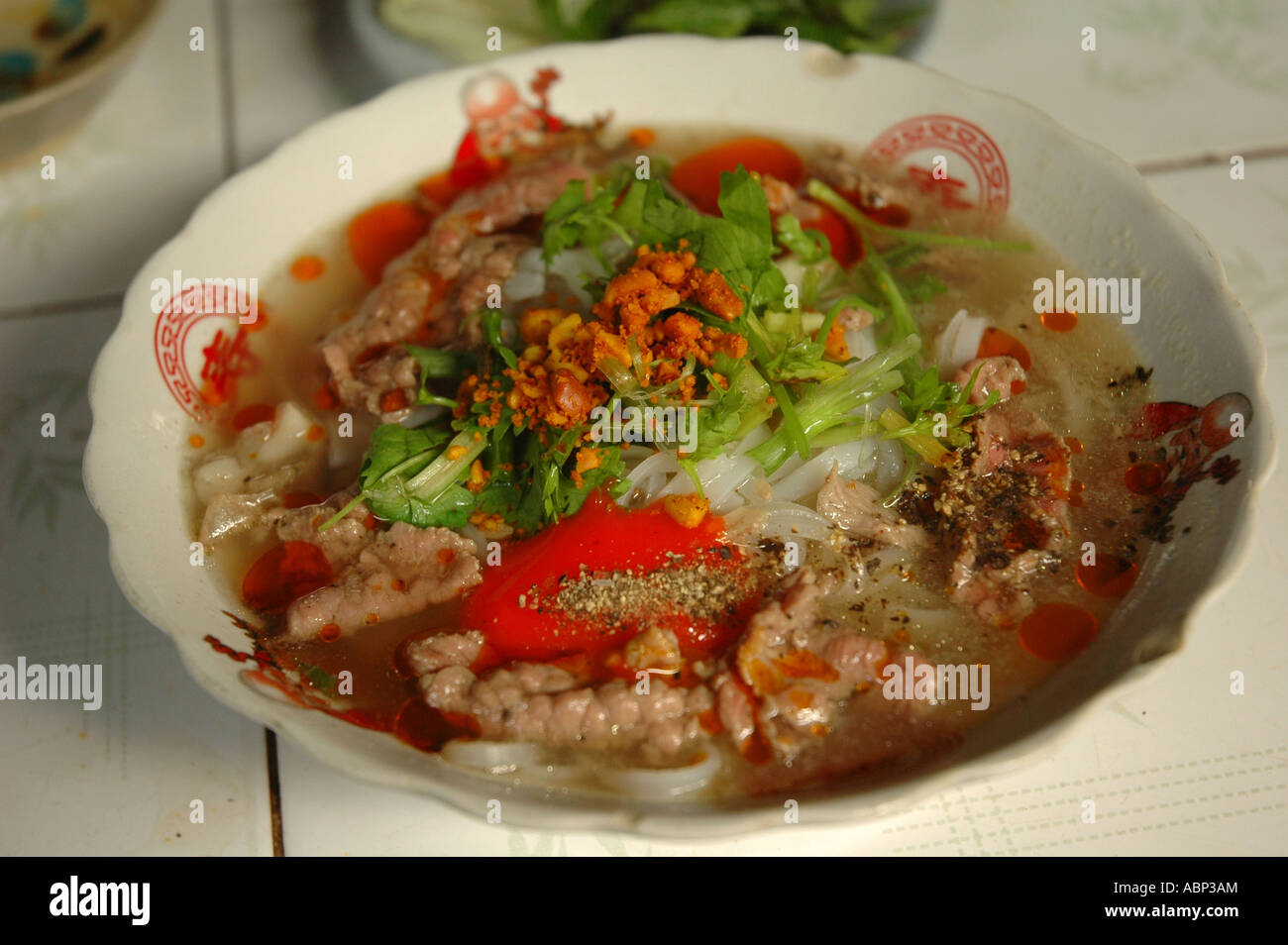 A bowl of pho bo from a market stall in Hoi An, central coast Vietnam. Stock Photo