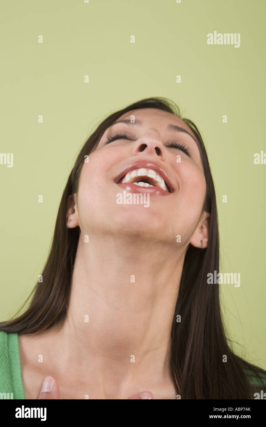 Woman laughing with head thrown back Stock Photo Alamy