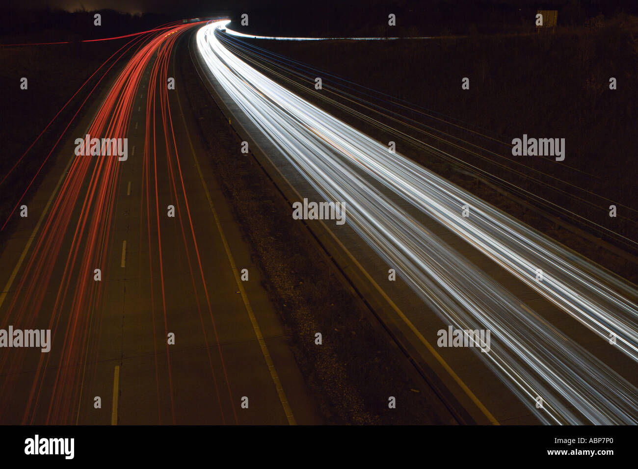 road at night time with cars going by Stock Photo - Alamy