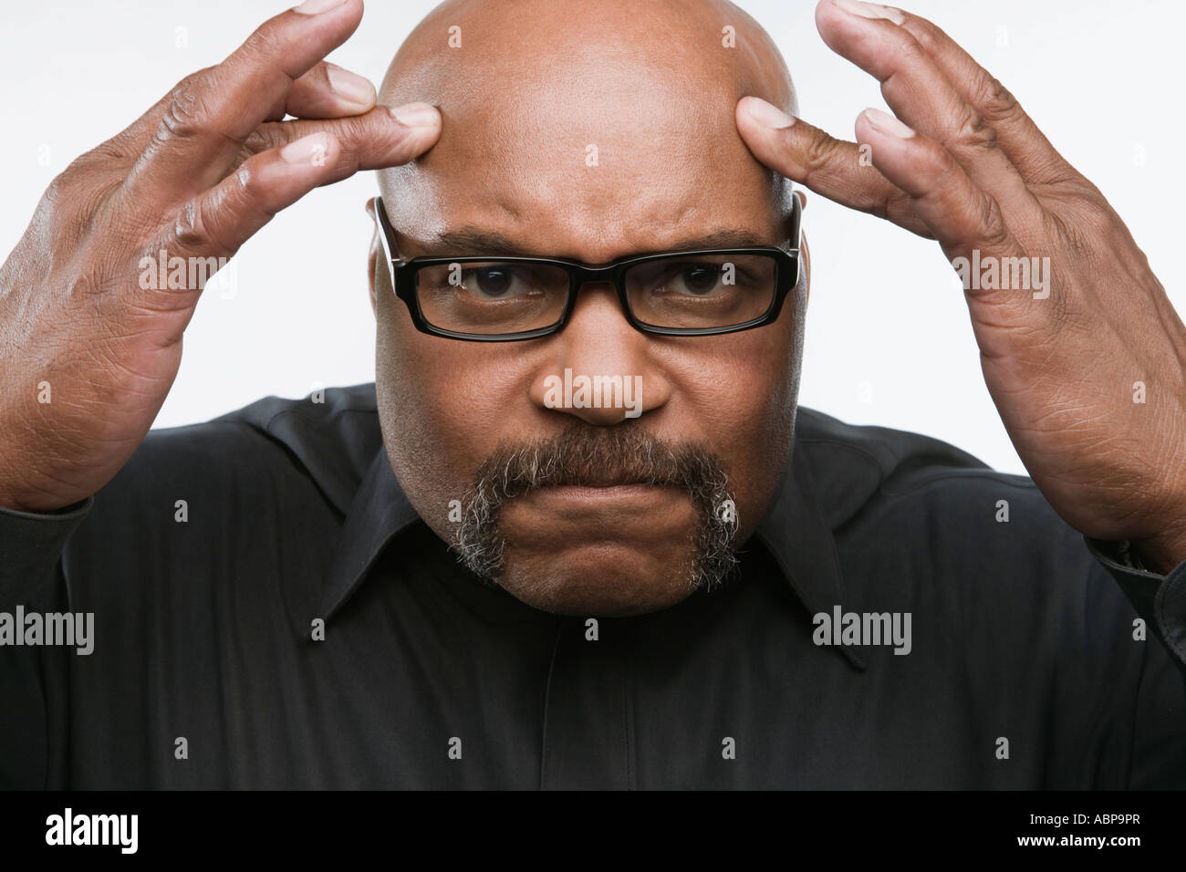 Man rubbing his forehead Stock Photo Alamy