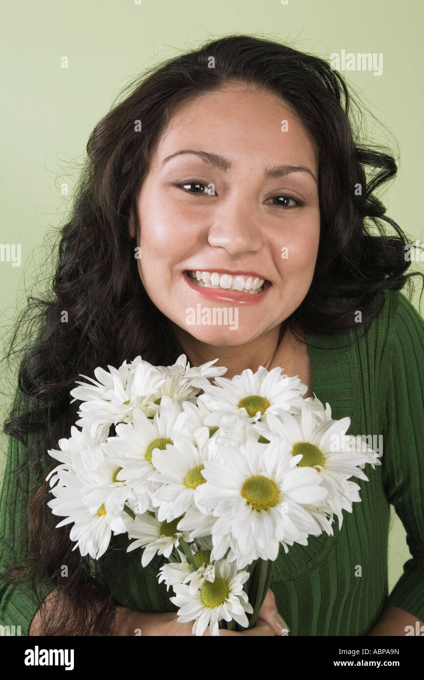 Woman holding bouquet of flowers Stock