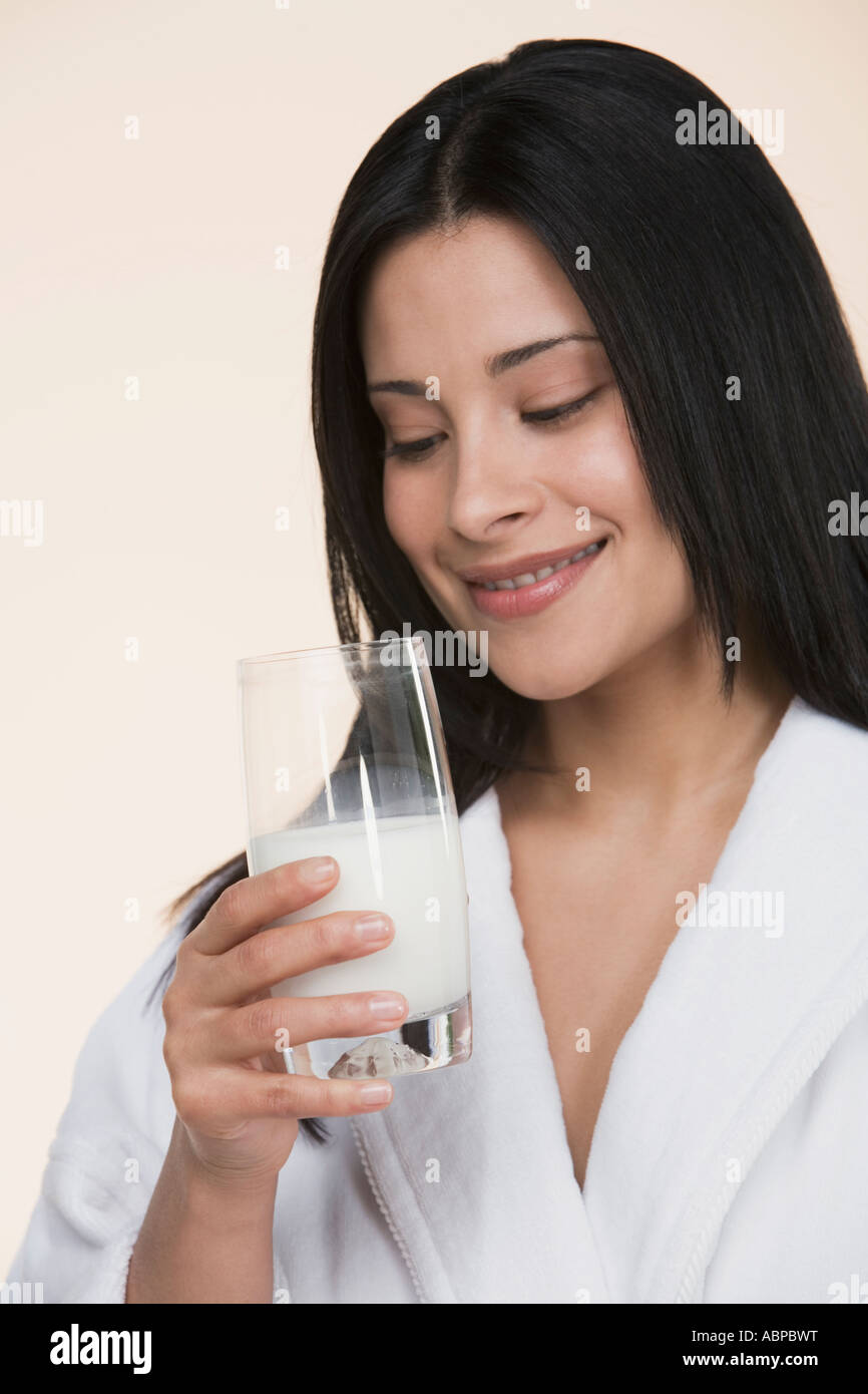 Woman drinking glass of milk Stock Photo Alamy
