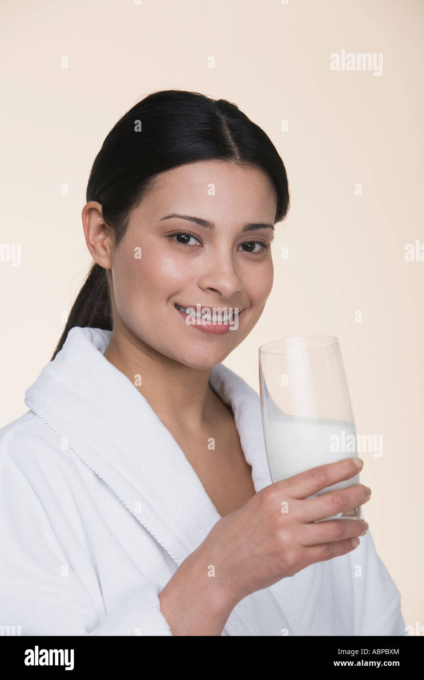 Woman drinking glass of milk Stock Photo Alamy