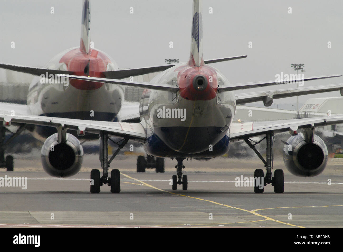 Two British Airways airliners taxiing on the runway at Heathrow Airport London Picture by Andrew Hasson May 18th 2006 Stock Photo
