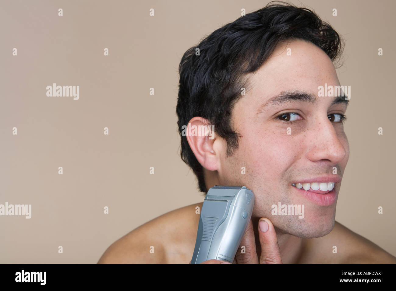 Man shaving with electric razor Stock Photo Alamy