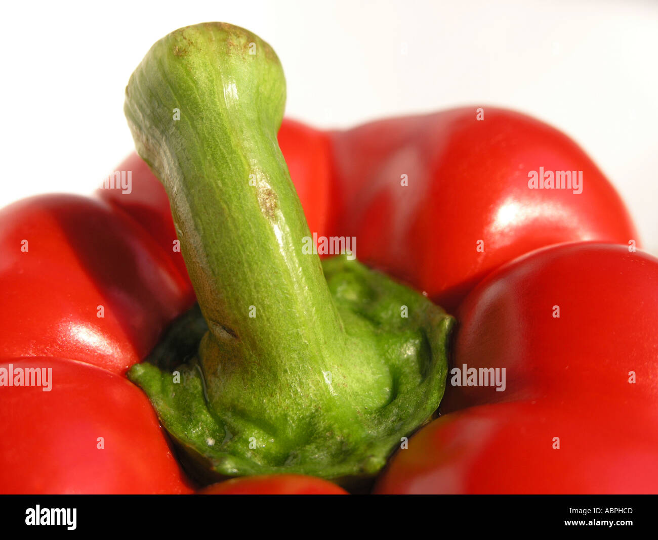 Fresh red pepper against a white background Stock Photo - Alamy