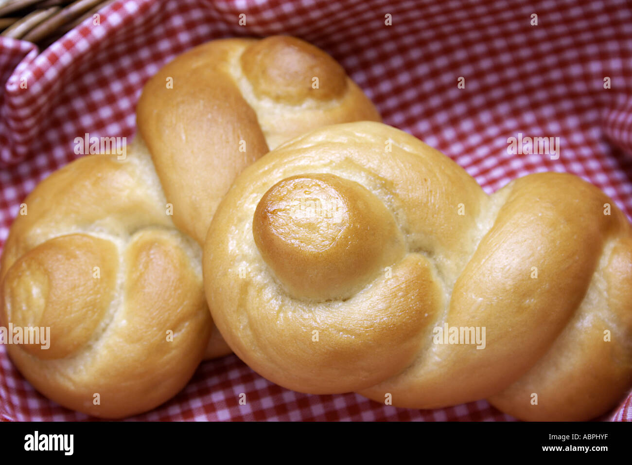VDA78878 Two pieces of dinner roll made of wheat flour on a napkin shape man sleeping Stock Photo