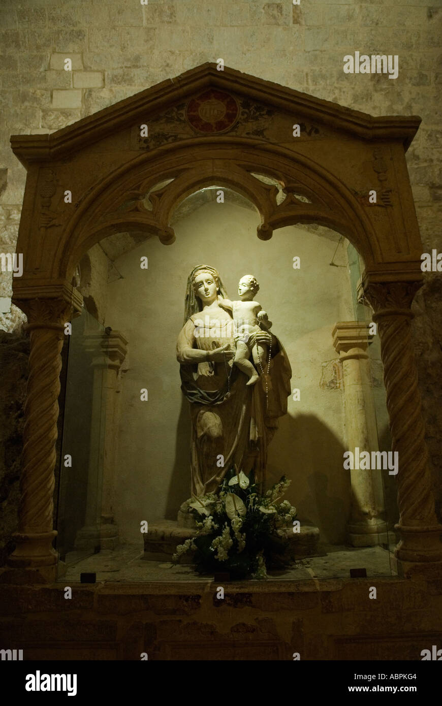 Statua San Michele Arcangelo Puglia A relief statue on the exterior wall of the Monte Sant’Angelo