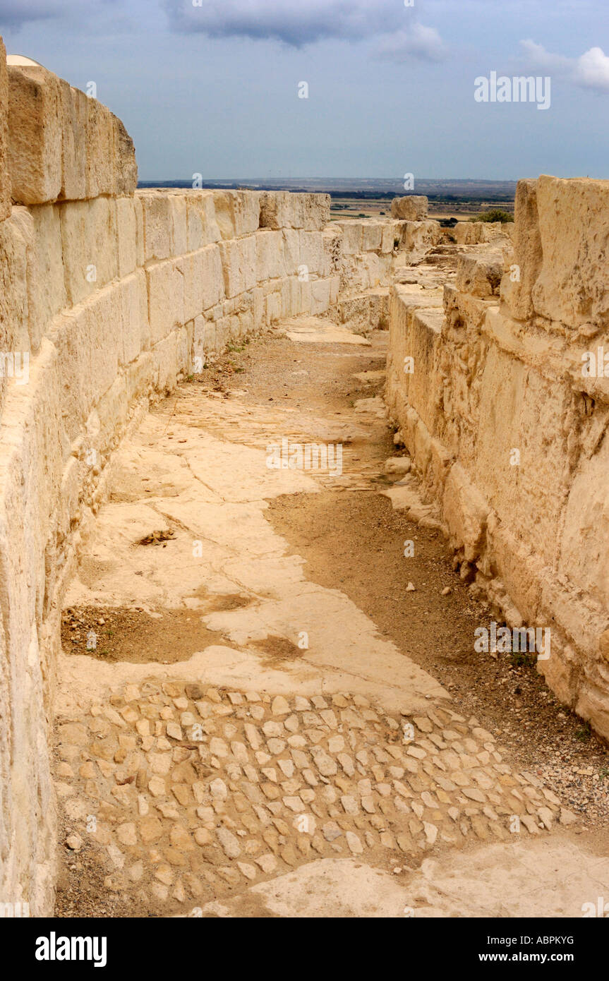 Way between two stone walls Kourion Archaeological Site Stock Photo