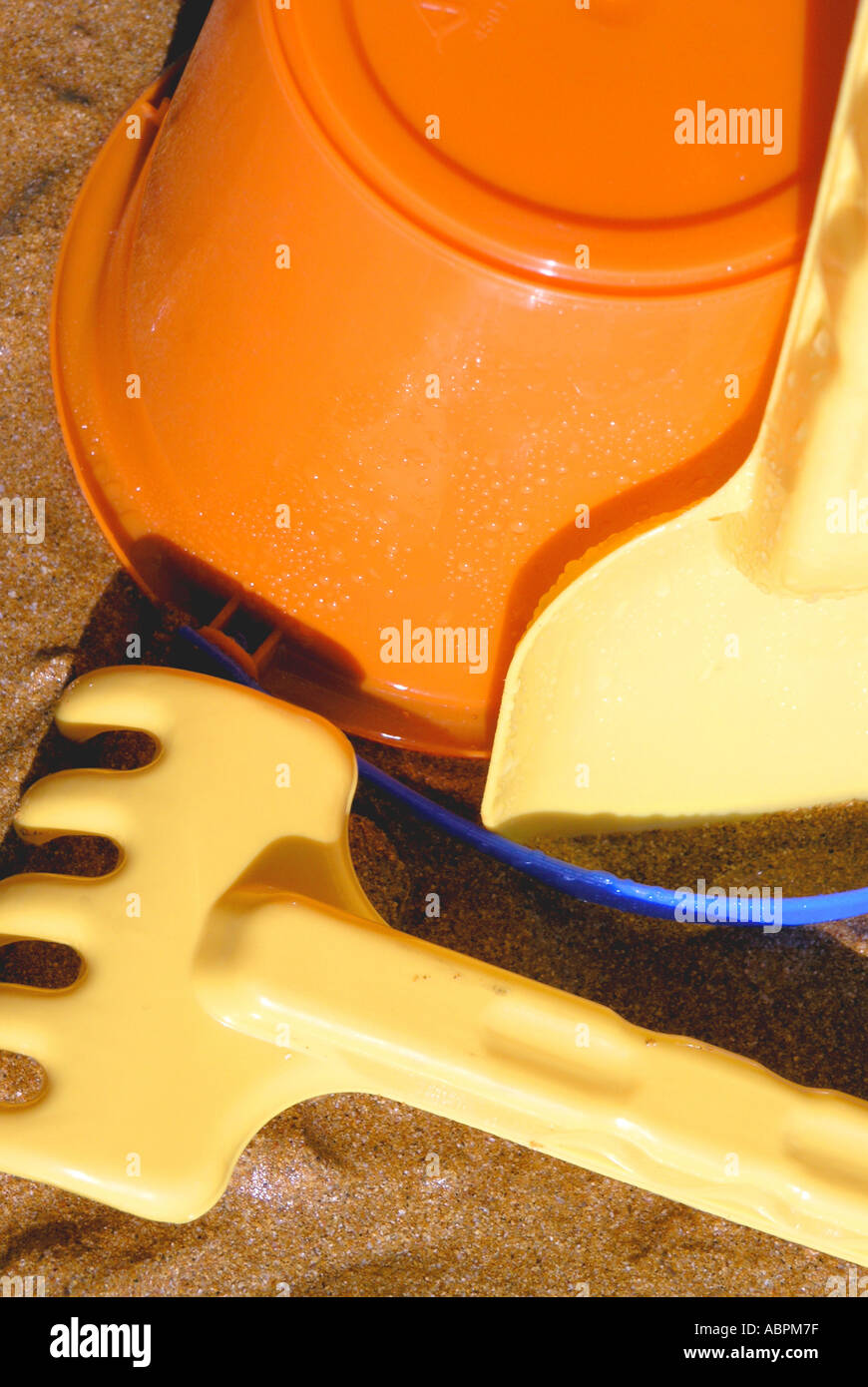 Childs plastic bucket and spade on a sandy beach Stock Photo Alamy