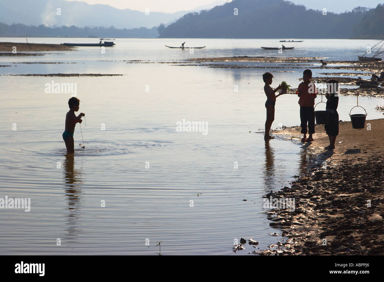 Lao children playing in river hi-res stock photography and images - Alamy