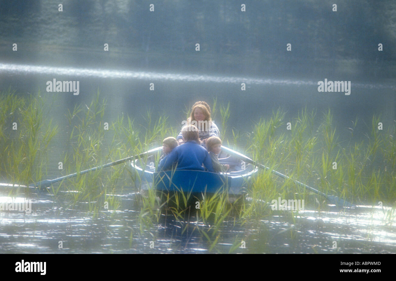Family outing in a boat Stock Photo Alamy