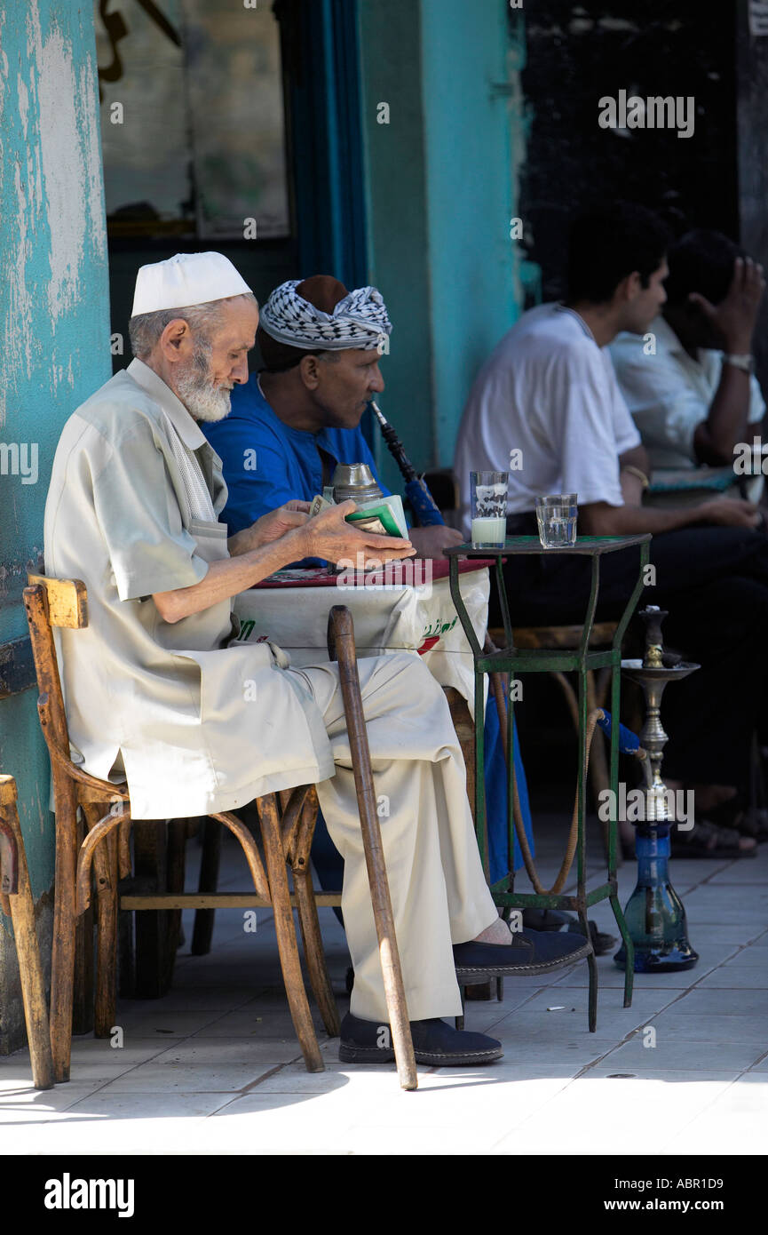 Men smoking Shisha tobacco molasses fruit infusions Cairo City Egypt ...