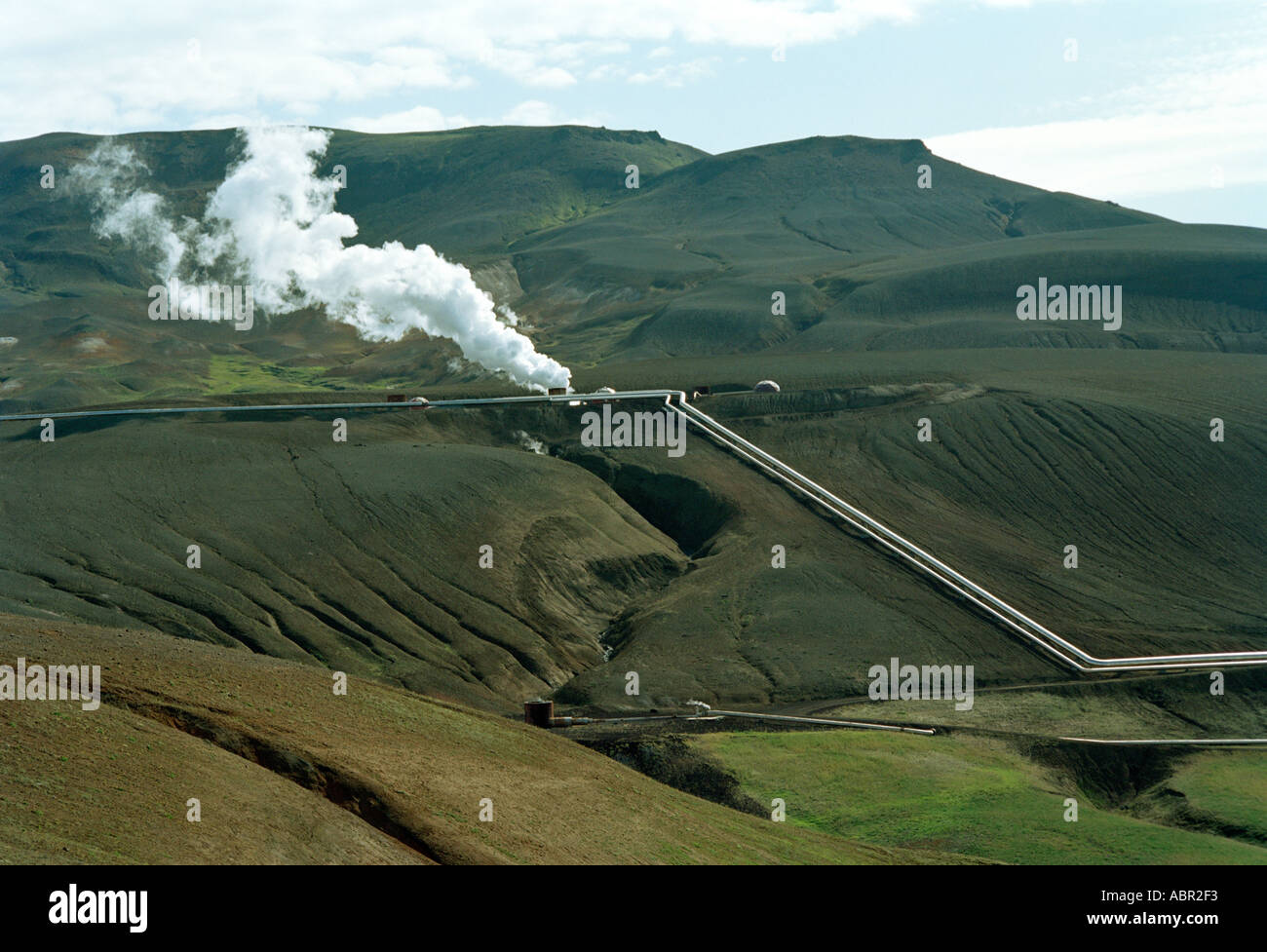 Steam rising in Mountains in the Geothermal Works at the Kroflustod Power Station, Myvatn, Iceland Stock Photo