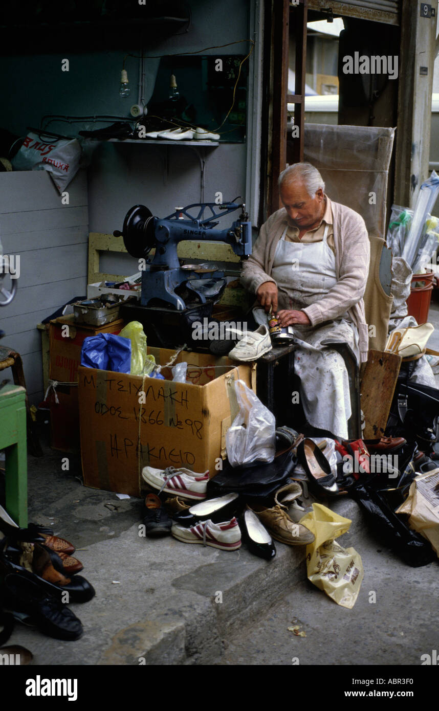 Traditional cobbler repairing shoes in Heraklion Crete Stock Photo - Alamy