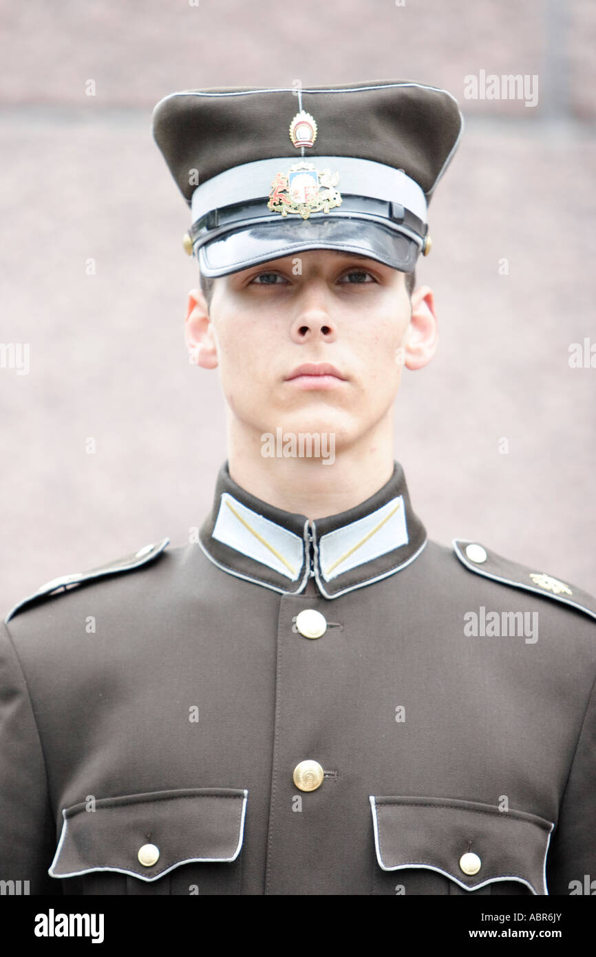 Latvian guard keeps watch in front of freedom monument Milda in Riga, Latvia Stock Photo