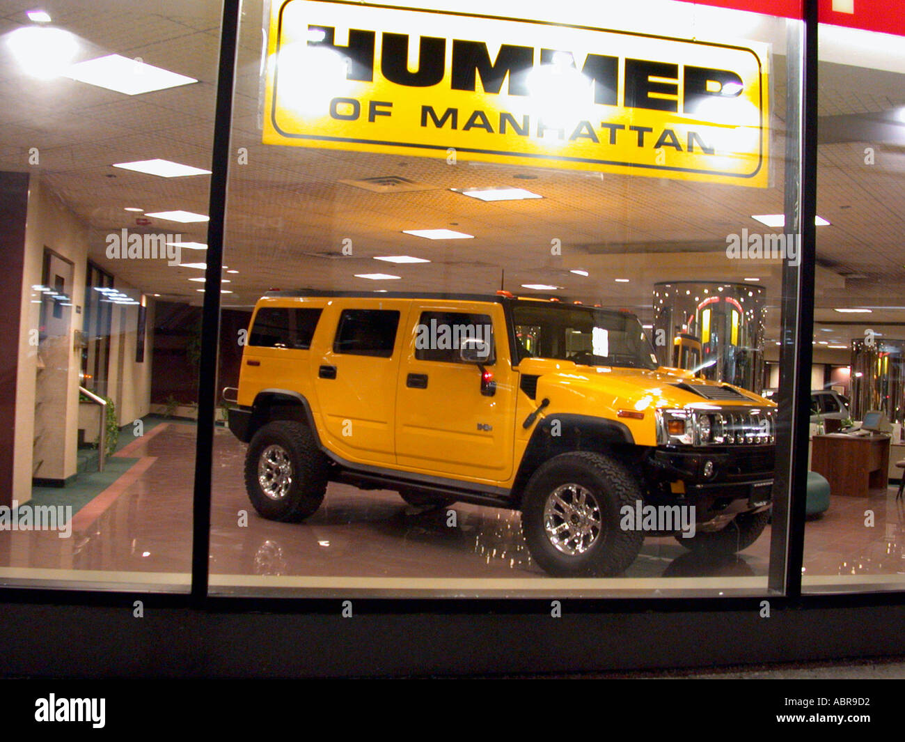 A brand new Hummer H2 sits in the Hummer of Manhattan dealership Despite it s fuel economy of only an estimated 13 mpg in the city and at 8 000 pounds fully loaded the H2 a smaller version of the original H1 has been selling fairly well to a combination of men and women Stock Photo