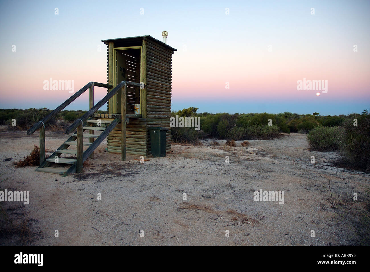Ecologically friendly composting toilet at moonrise Stock Photo