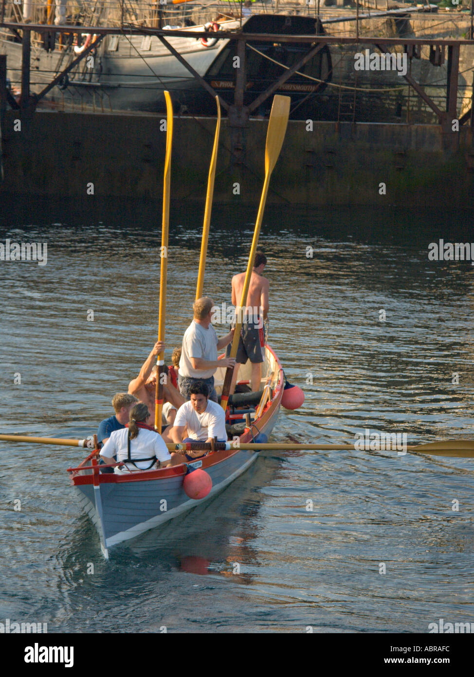 A pilot gig rowing team at Charlestown in Cornwall Stock Photo Alamy