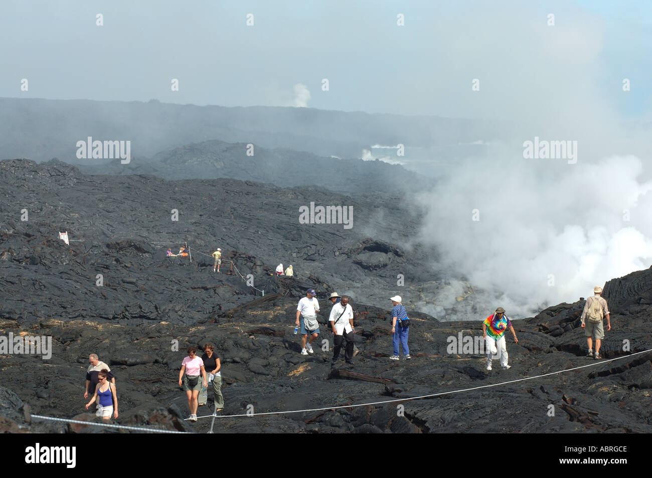 Visitors make their way to the designated view point West Highcastle ocean entry Hawaii Volcanoes National Park Stock Photo