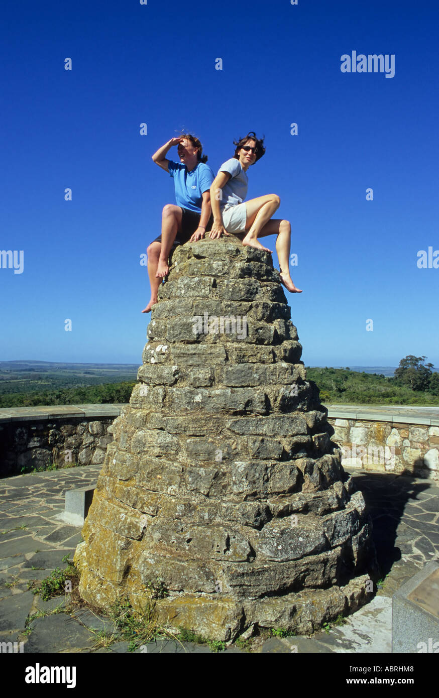 Two girls sitting on toposcope feature, Bathurst, South Africa Stock