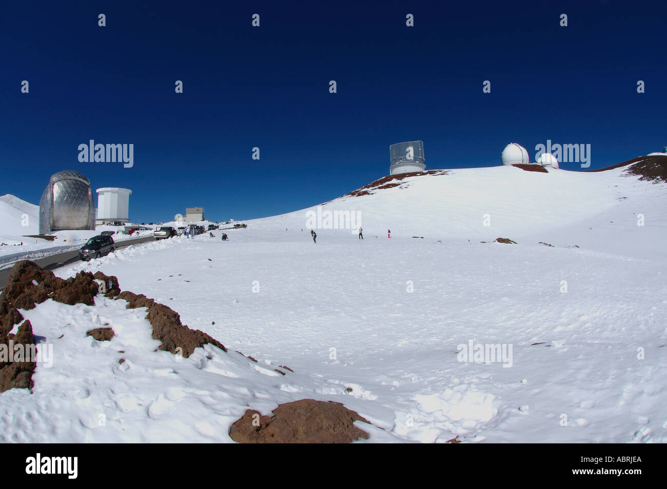 People enjoying the snow Mauna Kea The Big Island of Hawaii Stock Photo