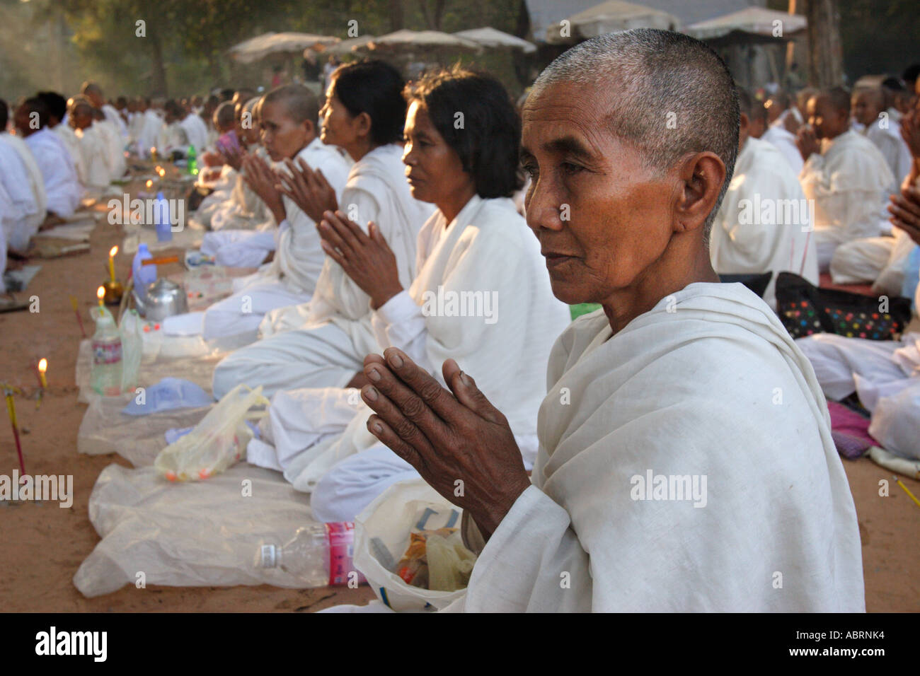 Buddhist nuns pray and meditate at the Bayon temple in Angkor Stock