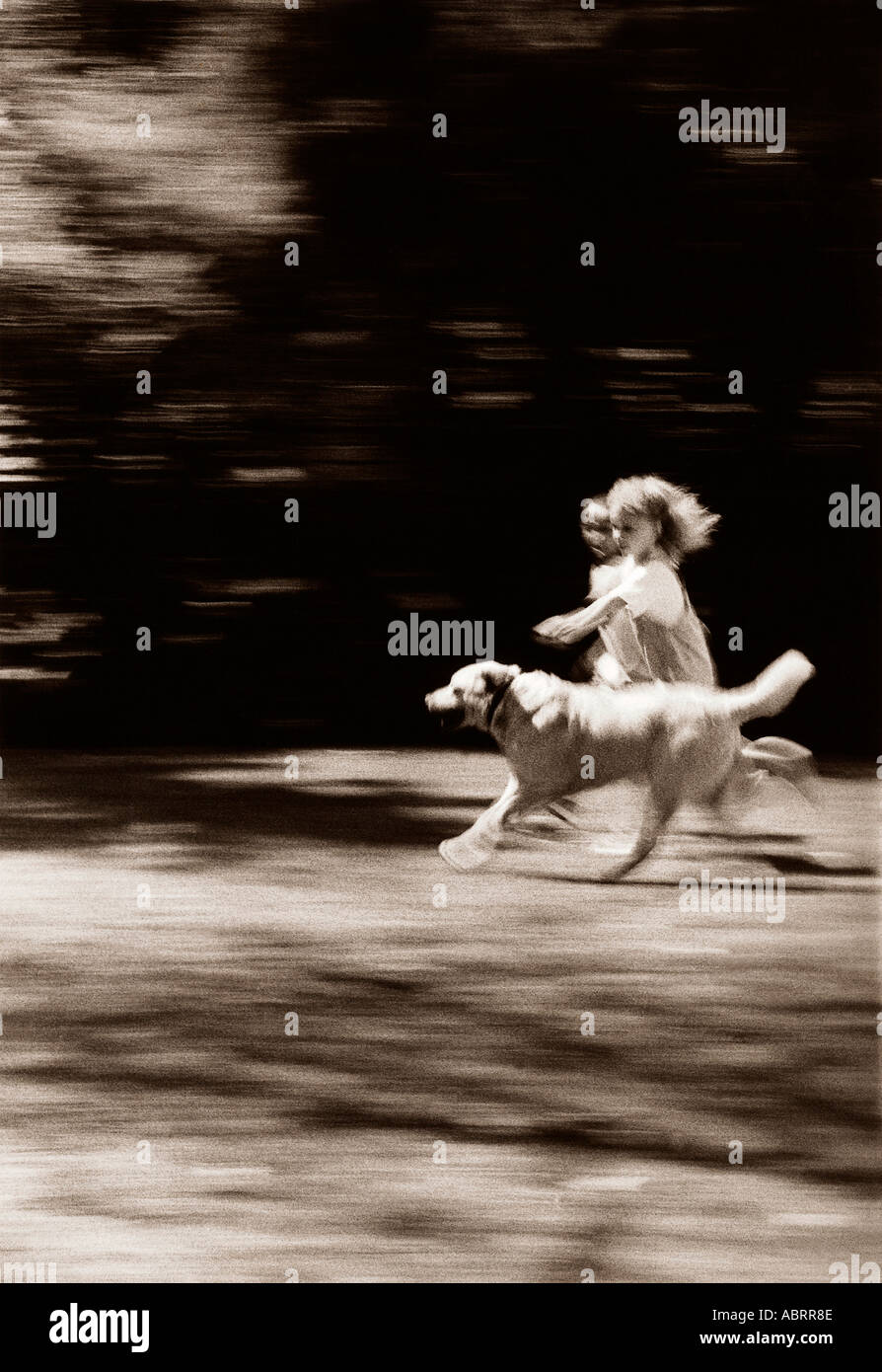 Two girls running with dog hi-res stock photography and images - Alamy