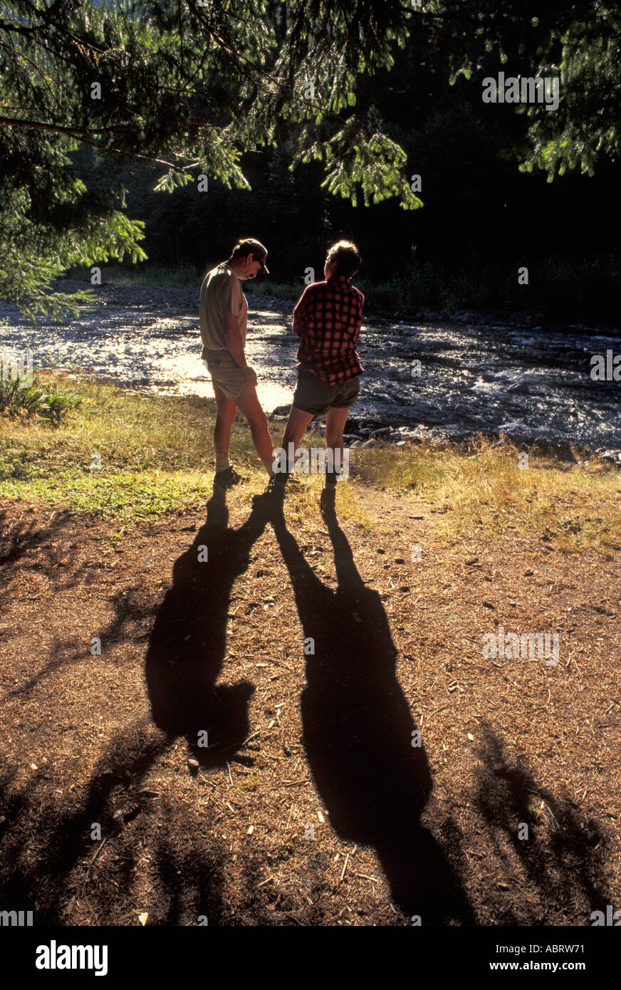Man and Woman Talk by River Stock Photo