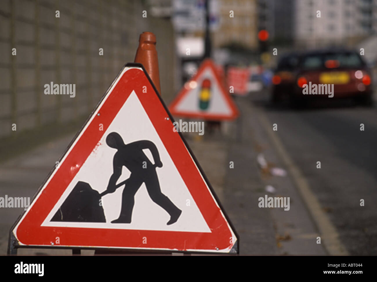Sign men at work, road works in London England HOMER SYKES Stock Photo