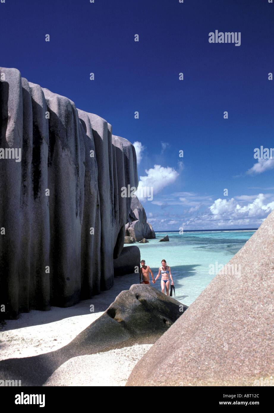 Seychelles Island of La Digue Snorkeling couple surrounded by large ...