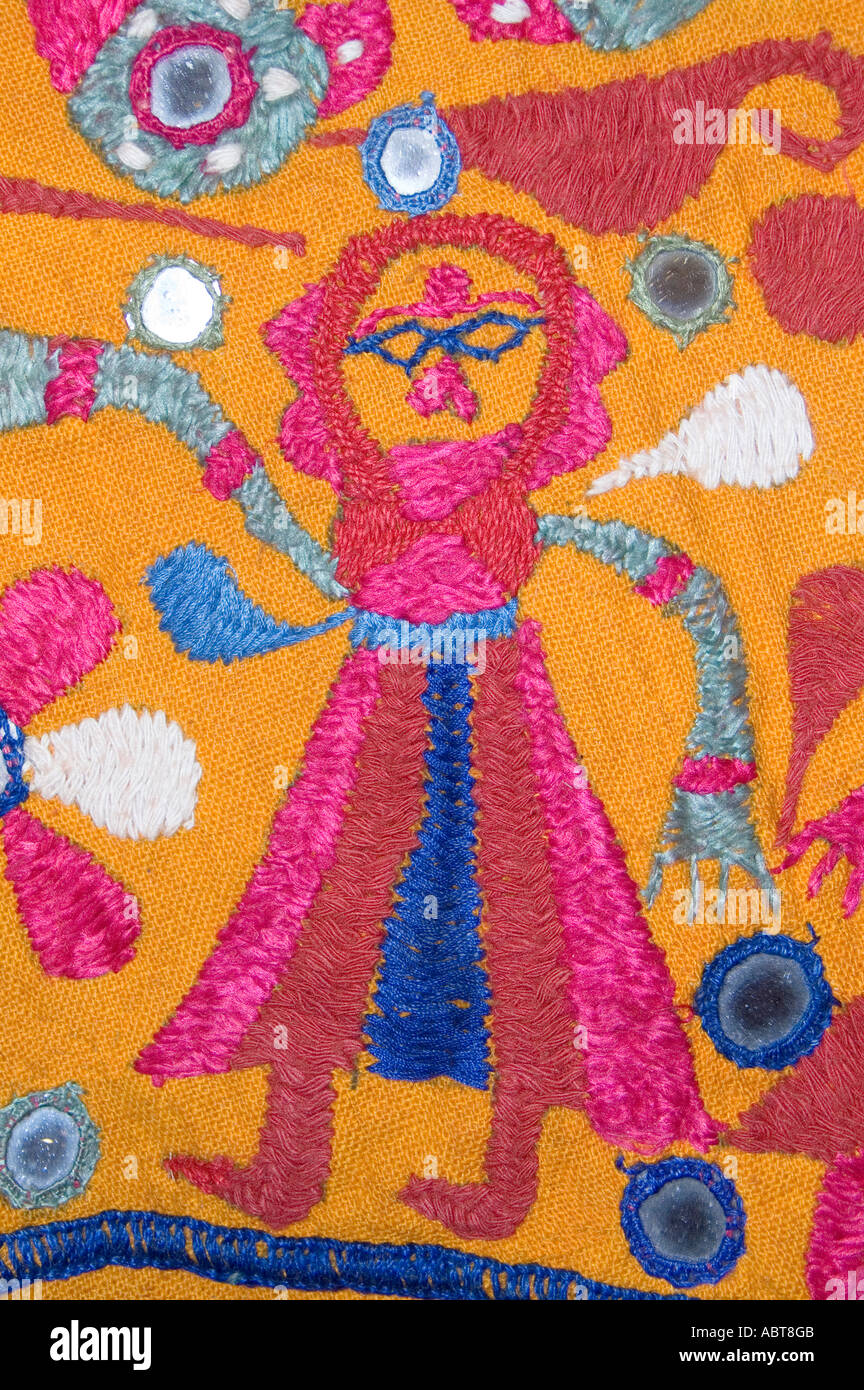 Detail of an embroidered wall hanging Textile from Rajahstan India Dancing woman Stock Photo