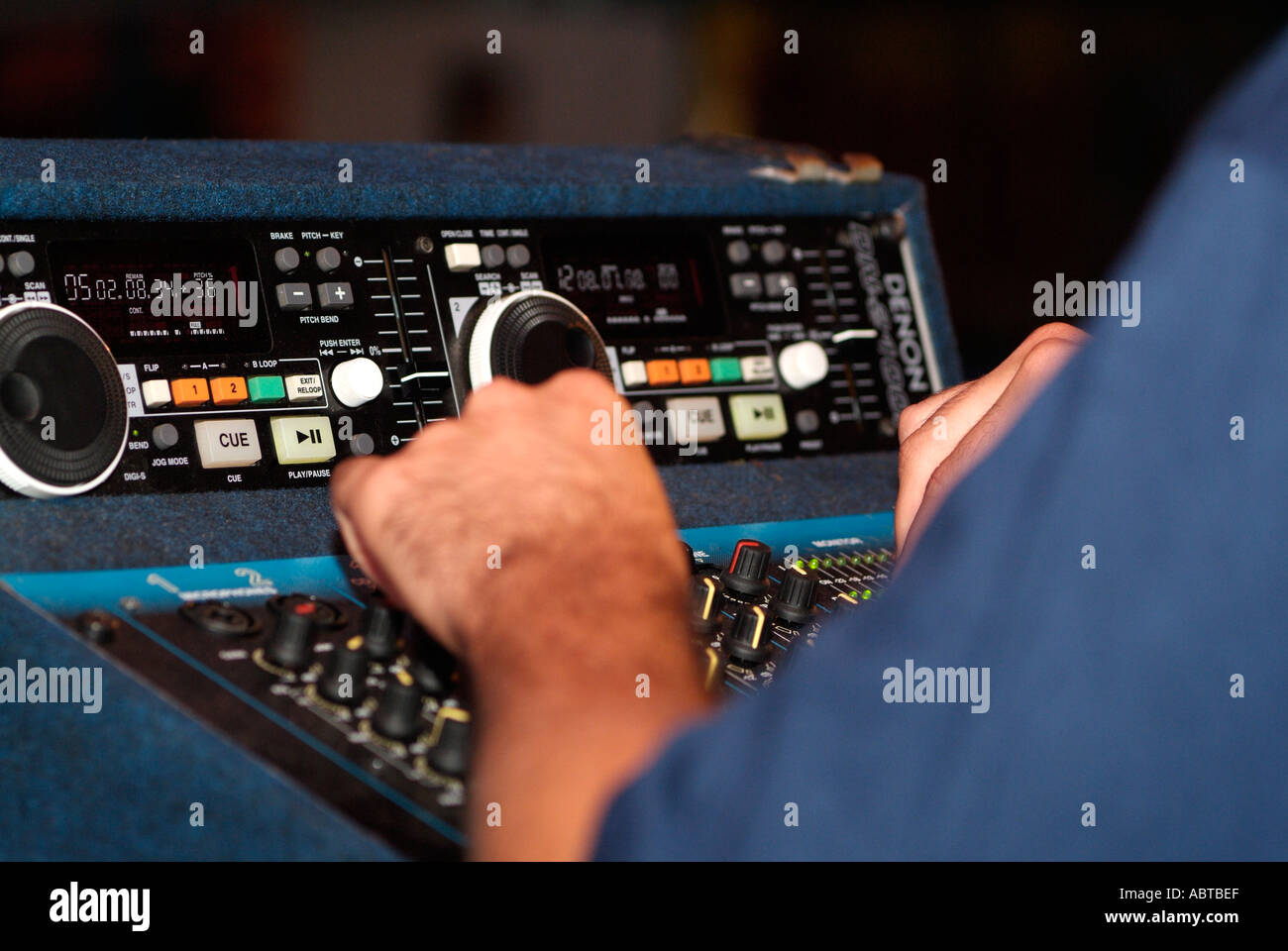 DJ Using an Electronic Mixing Desk Stock Photo