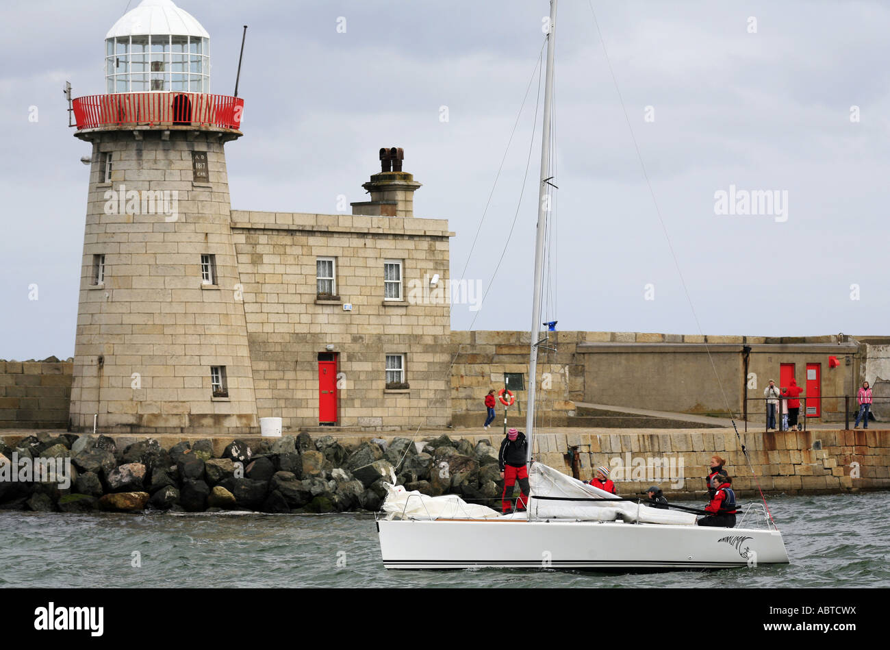 Yacht setting out from Howth harbour near Dublin Ireland Stock Photo