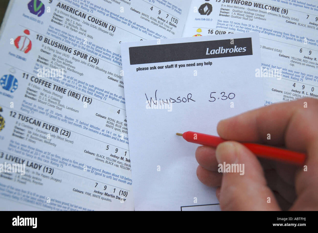 Ladbrokes betting slip and racecard Stock Photo
