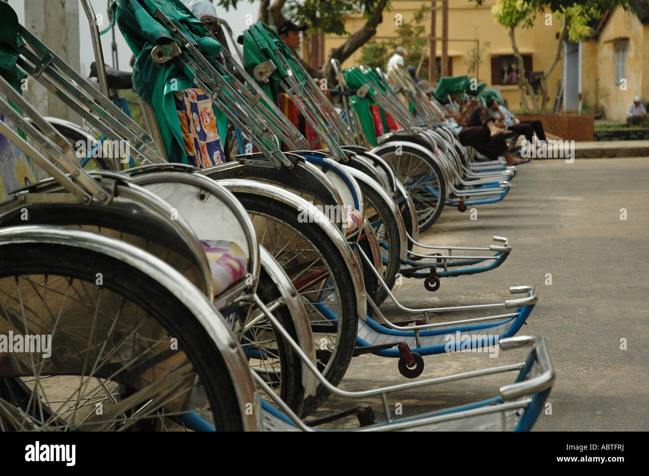 A line of cyclos in Hoi An on Vietnam's central coast. Stock Photo