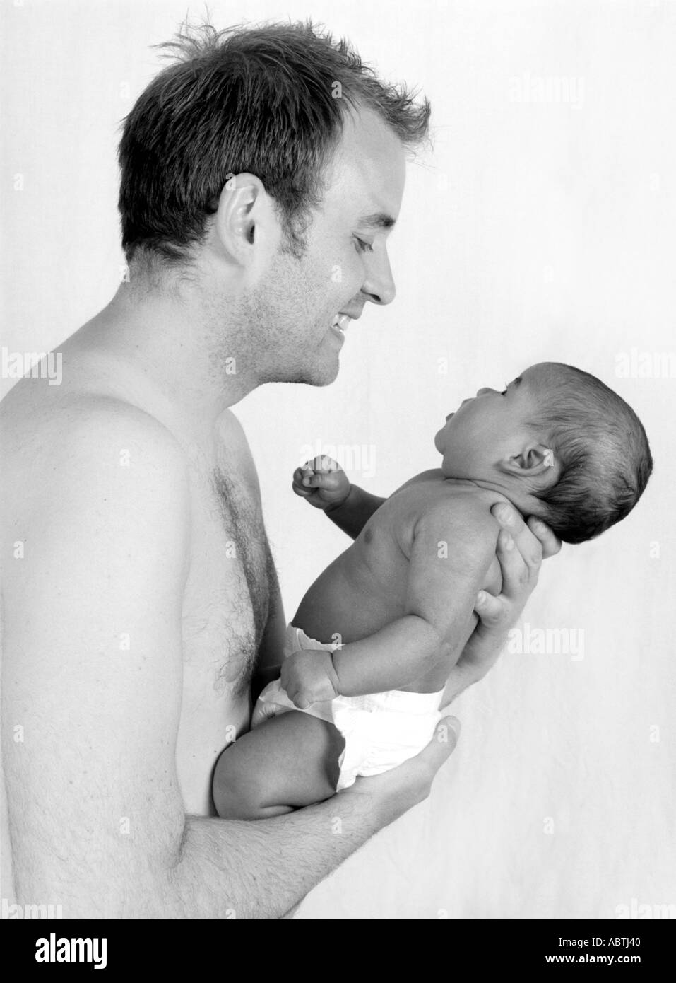 Caucasian Father Playing with his Baby Daughter Stock Photo