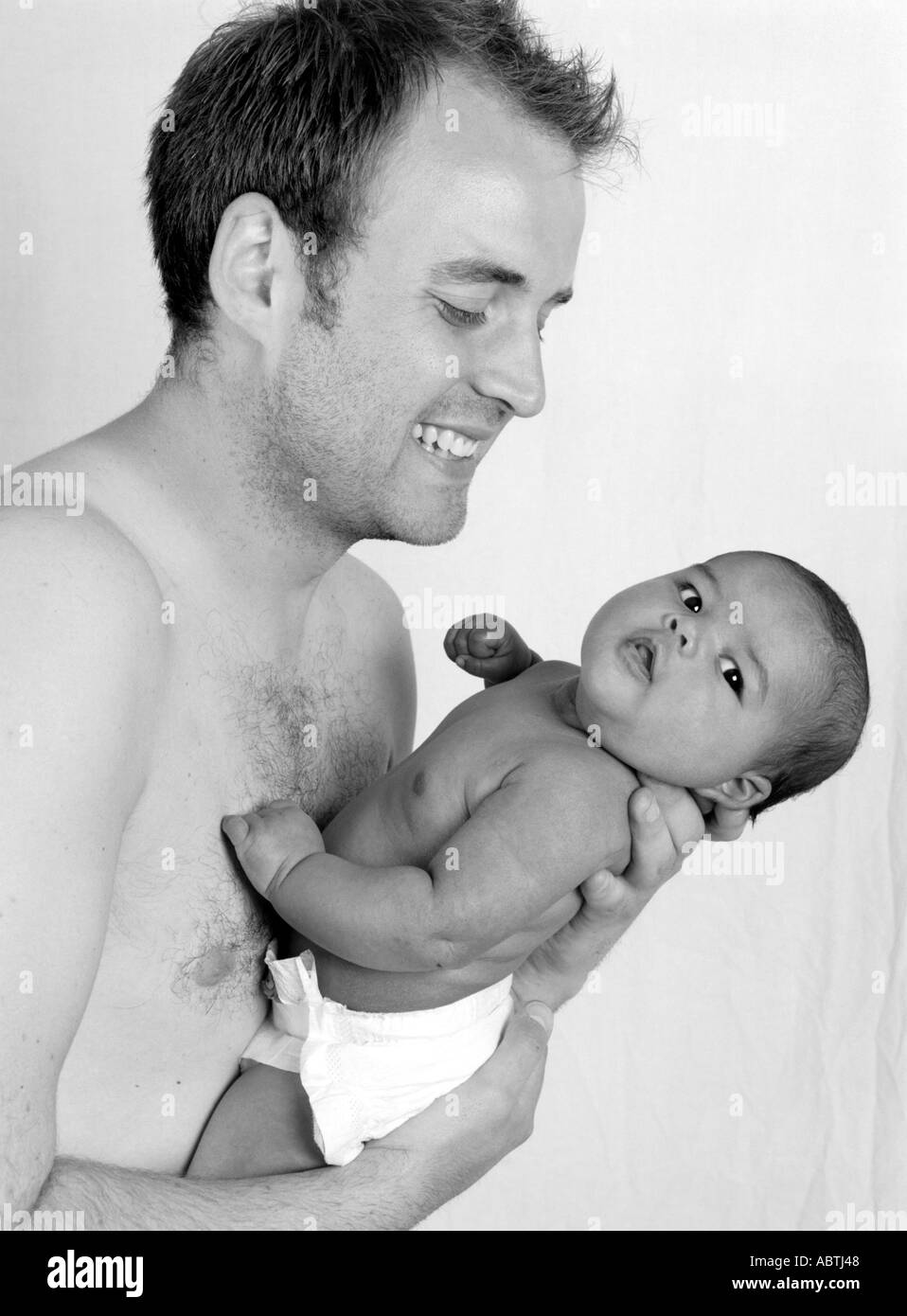 Caucasian Father Playing with his Baby Daughter Stock Photo