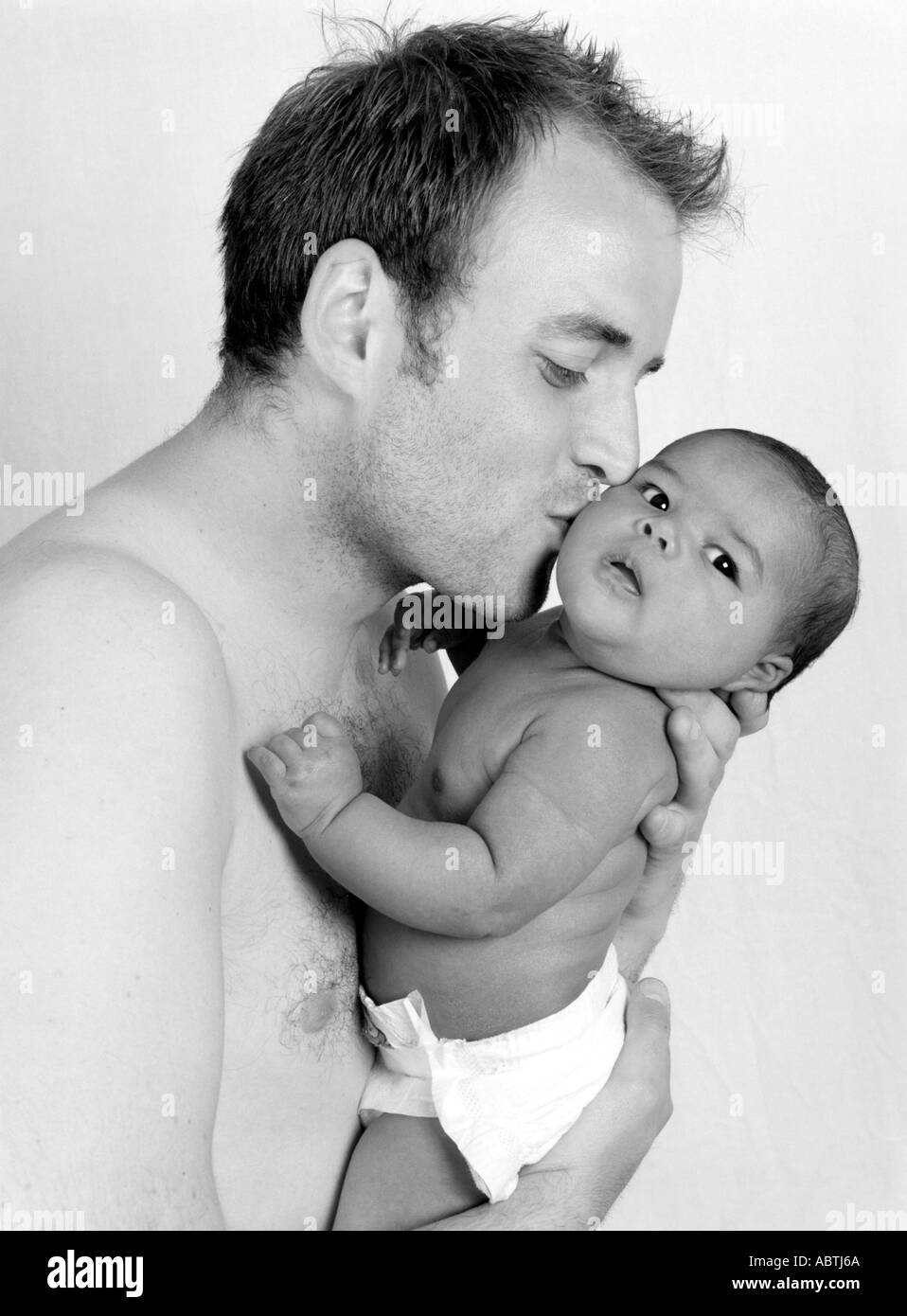 Caucasian Father Playing with his Baby Daughter Stock Photo